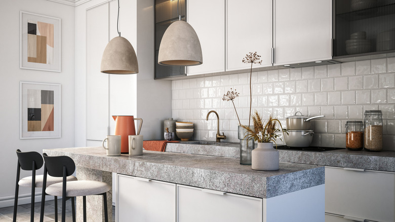 A mostly white kitchen with pops of color.