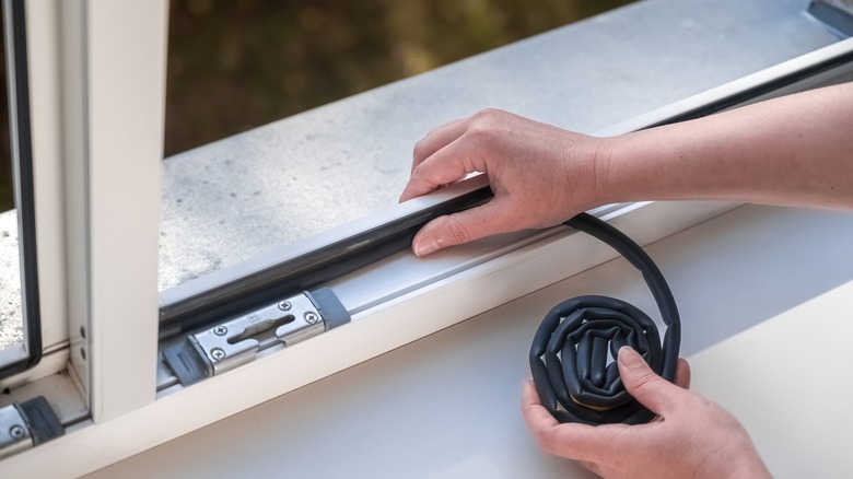 sealing a window to prevent bug infestation