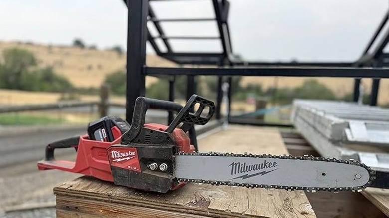 Chainsaw sitting on a wooden platform