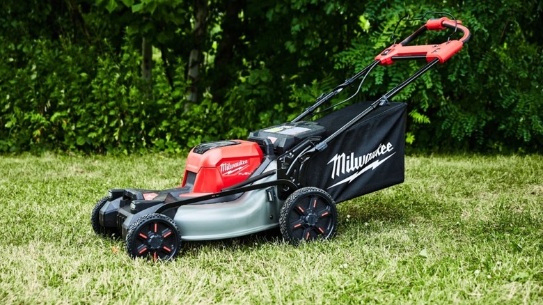 Milwaukee mower sitting outside in the grass