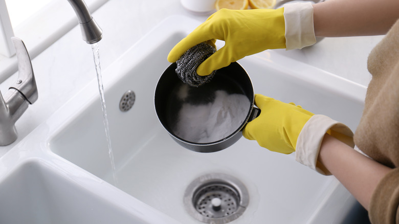 woman washing a pot