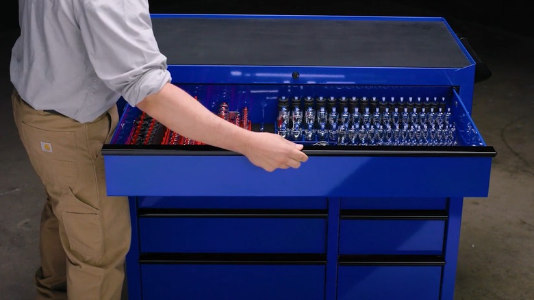 Man opening a drawer on a U.S. General tool chest