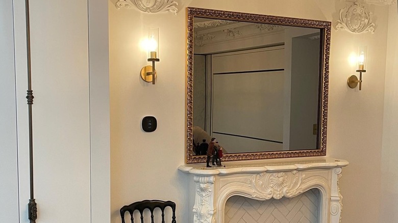 An ornate framed mirror TV in the Plaza Hotel