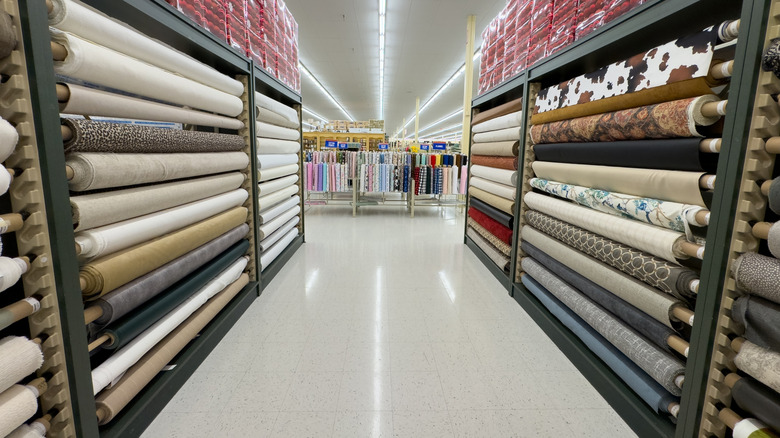 Rolls of upholstery fabric in a Hobby Lobby store.