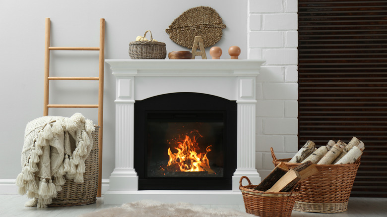white fireplace with baskets