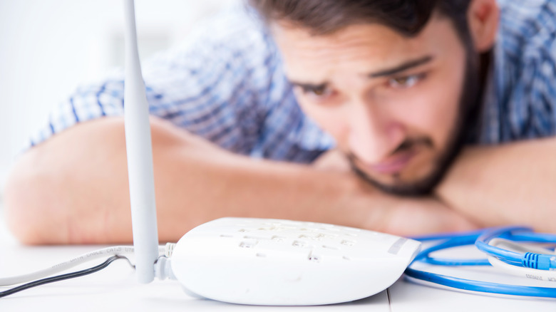 man with Wi-Fi router