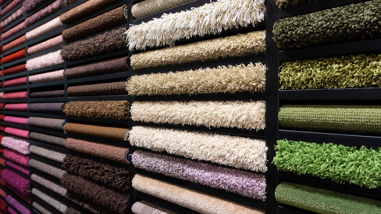 colorful carpet samples on wall