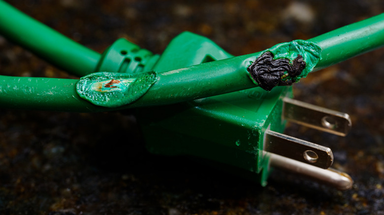 A damaged electrical cable in need of repair