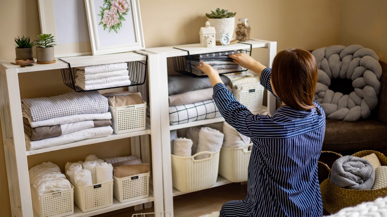 woman organizing shelves