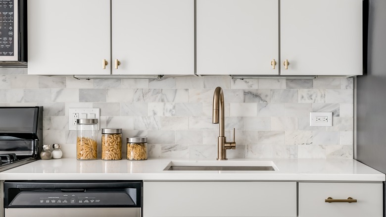 modern white kitchen white backsplash