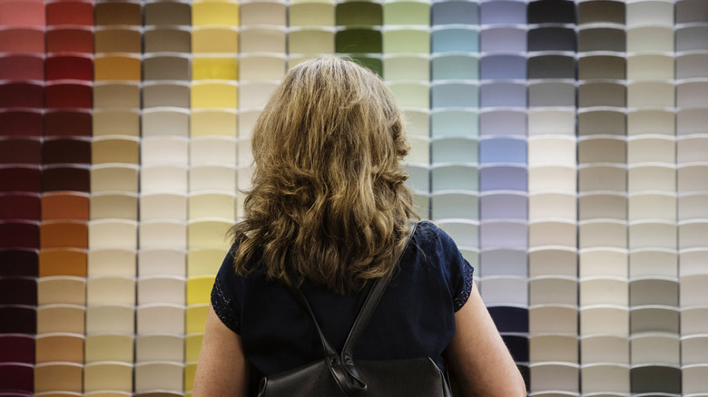 Woman shopping for paint samples