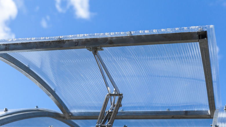 Polycarbonate sheet glass skylight, propped open