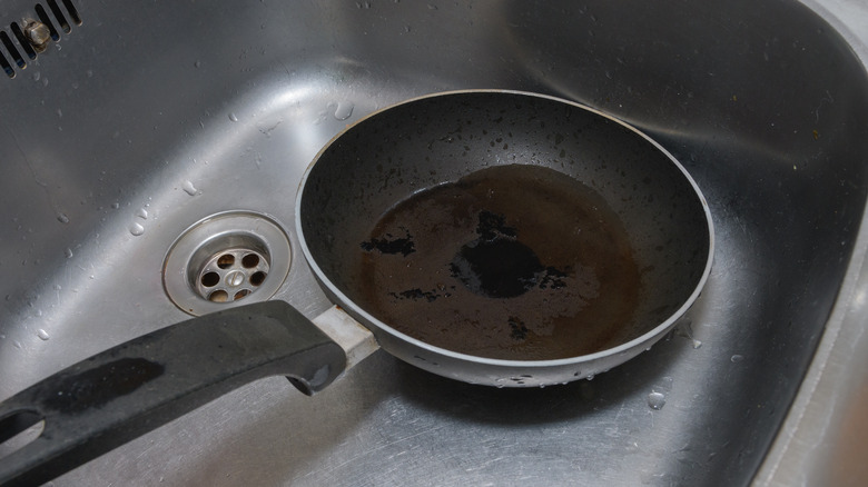 frying pan in sink