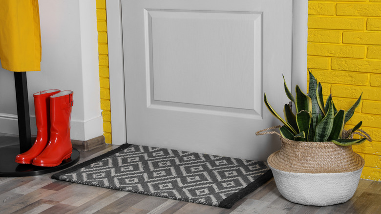 Small door mat on floor near entrance