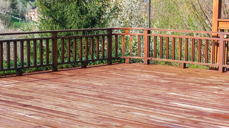 Large deck with handrail outdoors 