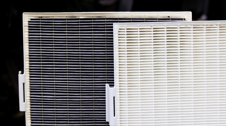 a new and an old air filter placed together