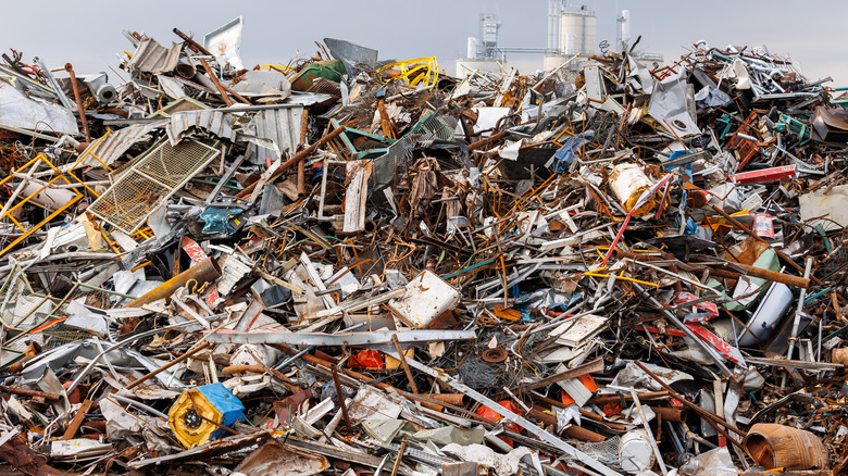 scrapyard with metal waste dumped