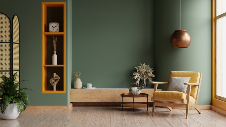 Home with sage green walls and mustard accents