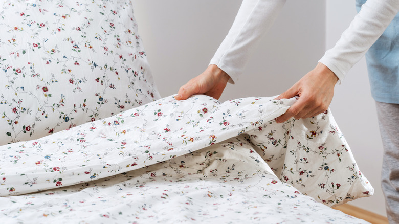 Folding over bedding with white floral design