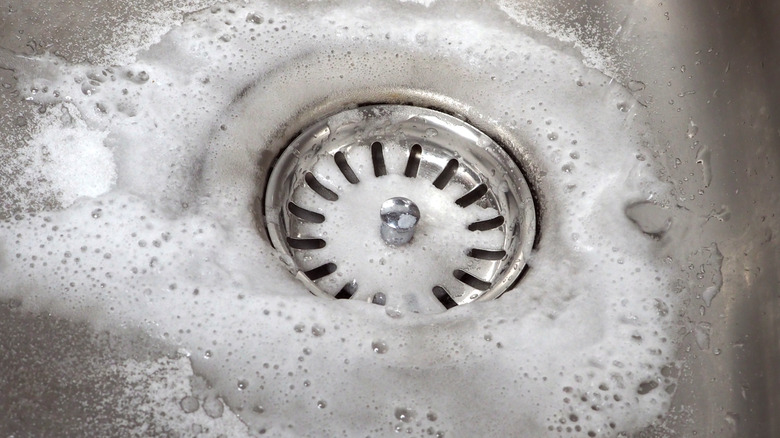 baking soda mixture going down a sink drain