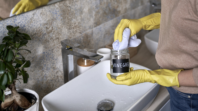 woman cleaning with vinegar