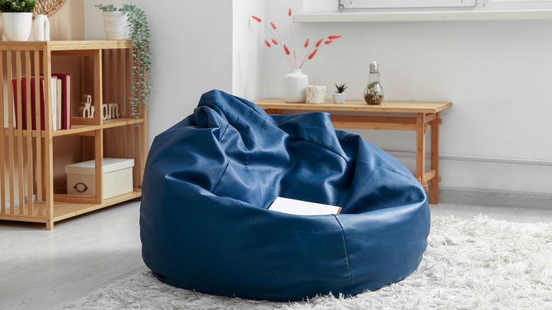 a blue bean bag in a simply styled living room