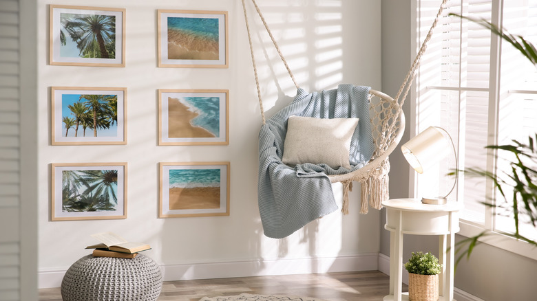 An organized gallery wall arranged in a grid fashion with identical frames and matting
