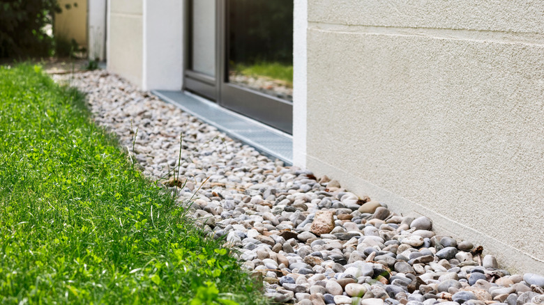A French drain along home's exterior wall to direct water away from the foundation and basement