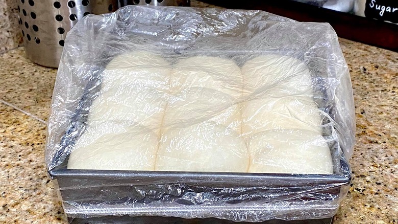 Rolls are covered with a shower cap as they rise.