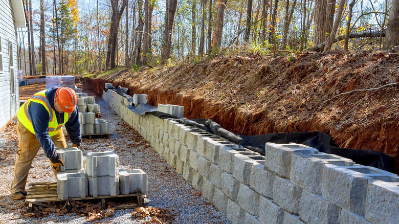 mason building retaining wall