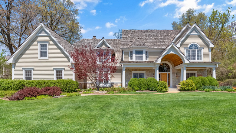 Traditional home with green lawn