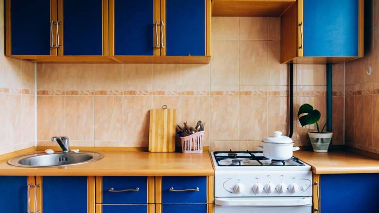 ugly kitchen with blue cabinets