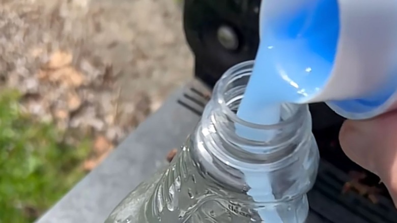 Putting fabric softener into a spray bottle