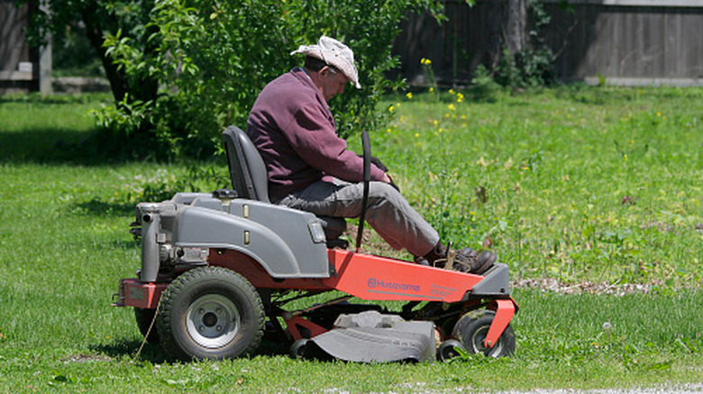 Man sitting on a zero turn lawn mower