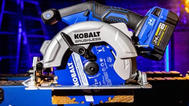 circular saw cutting through a board
