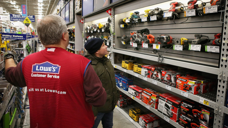 employee standing at a display in Lowe's