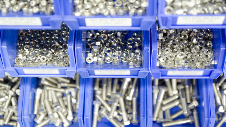 A workshop organizer with blue drawers that are labeled