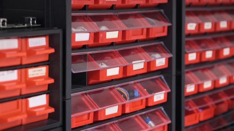 Nuts, bolts, and other small parts organized in a drawer system
