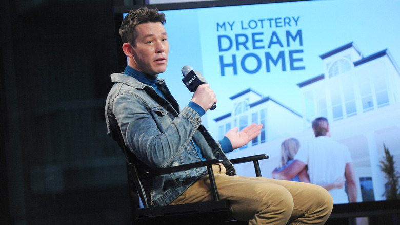 David Bromstad holding mic