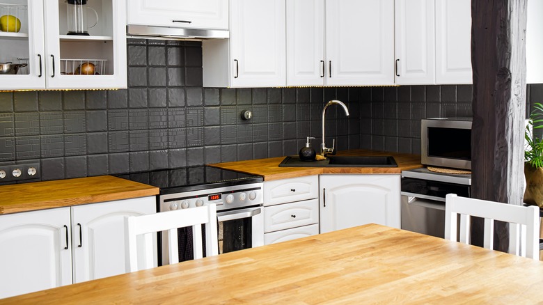 white cabinets and wood countertops