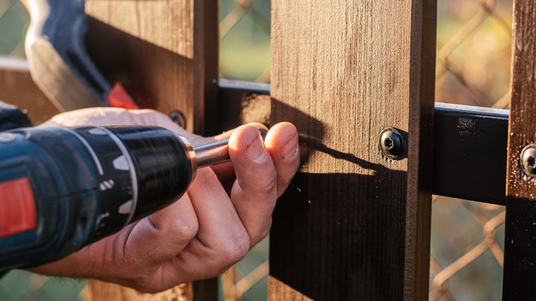 Screwing fence picket to rail