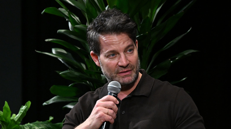 Nate Berkus holding a microphone