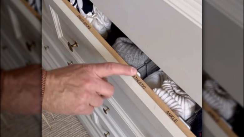 Nate Berkus shows labels inside a drawer