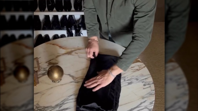 Nate Berkus demonstrating how to fold sweatpants