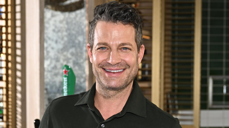 HGTV's Nate Berkus standing in front of bar