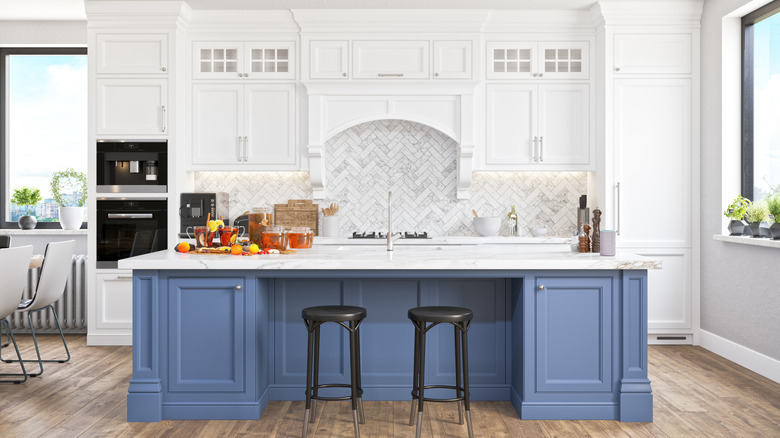 Light white and light blue cabinet colors in sunny kitchen