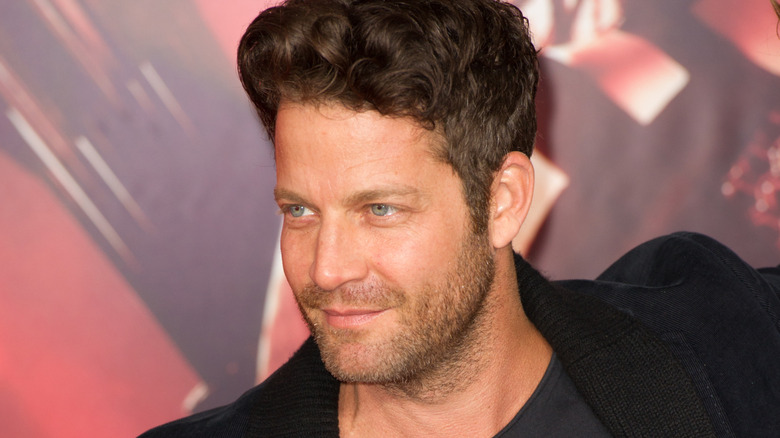 Nate Berkus poses at an event