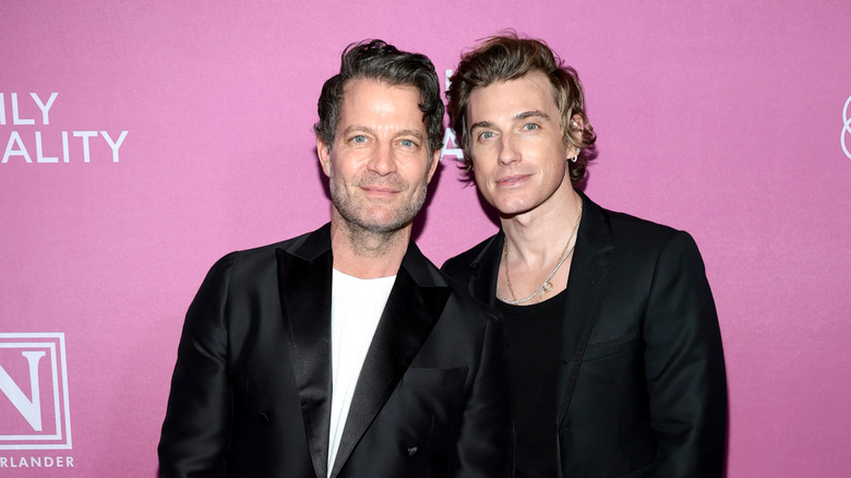 Nate Berkus and Jeremiah Brent with a pink background.
