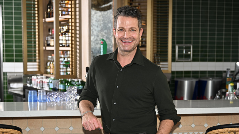 Nate Berkus leaning on bar