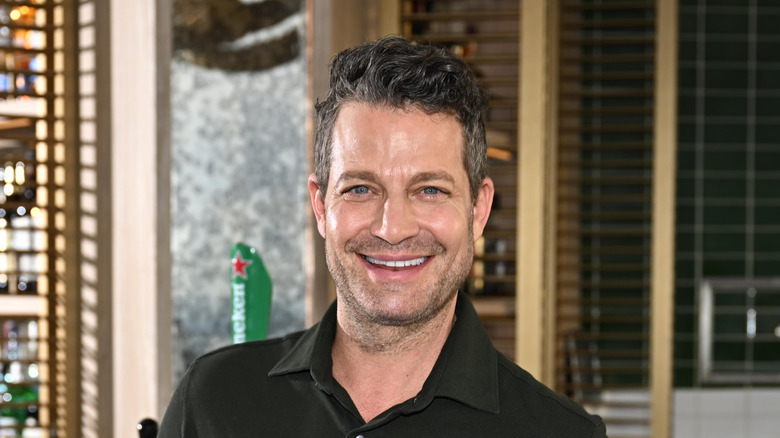 Nate Burkus standing at a bar